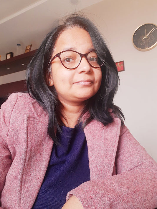 A photograph of Neha, a mandala artist.