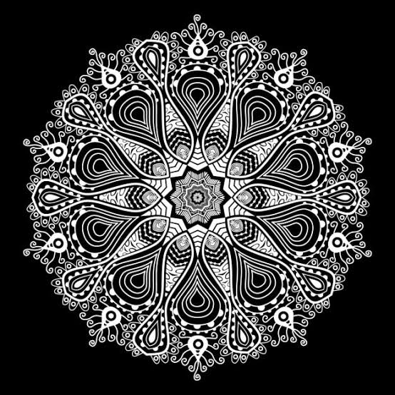 A monochromatic mandala made against dark background.