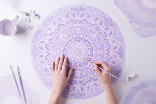 An intricate mandala design being drawn.